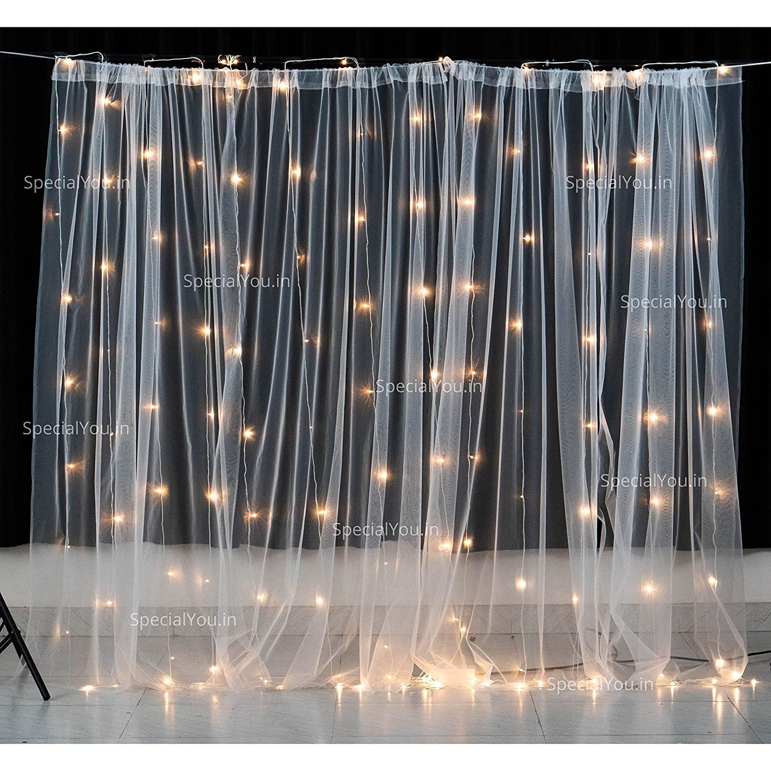 white curtain and fairy light