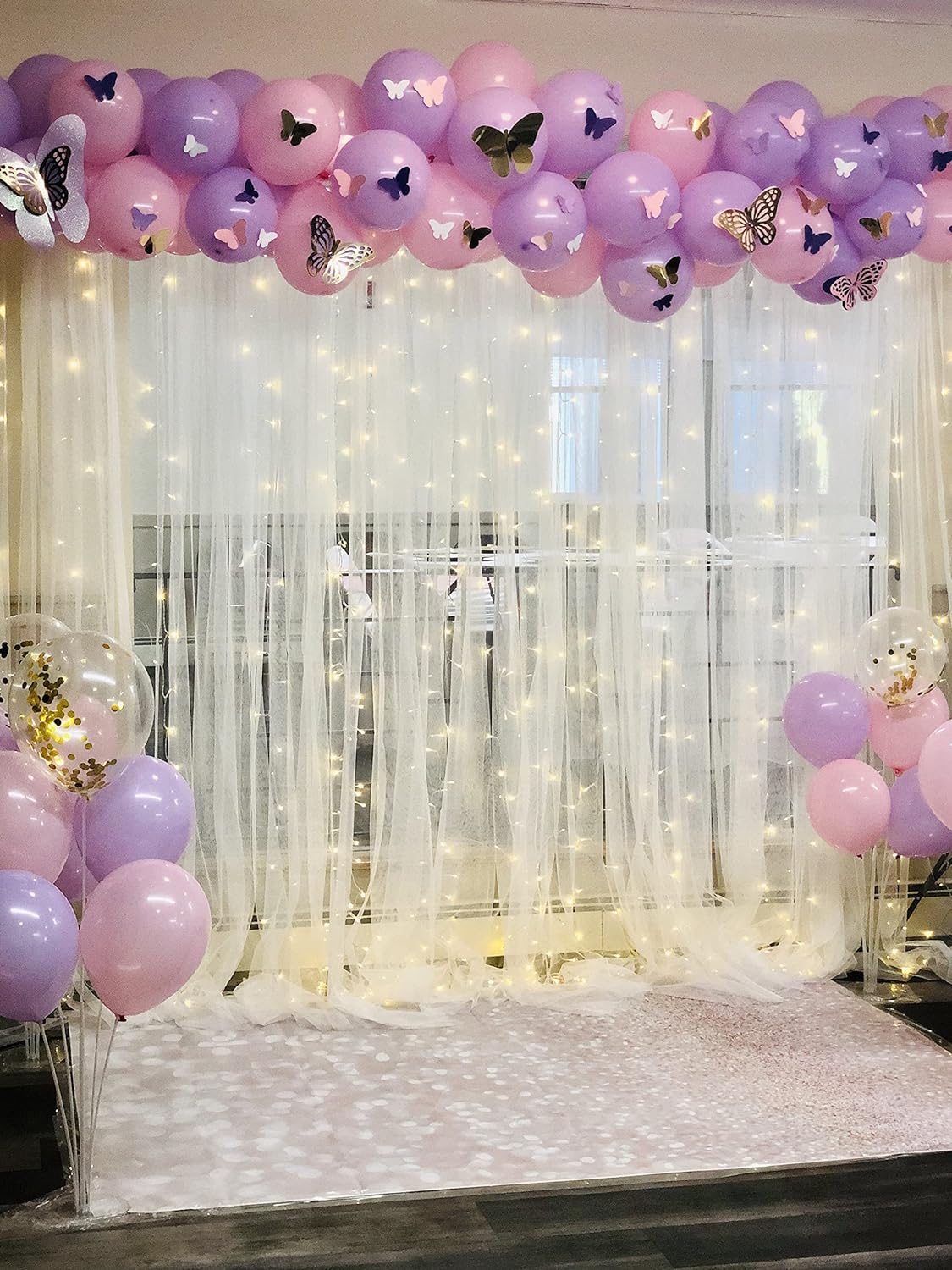pink purple balloons with curtain